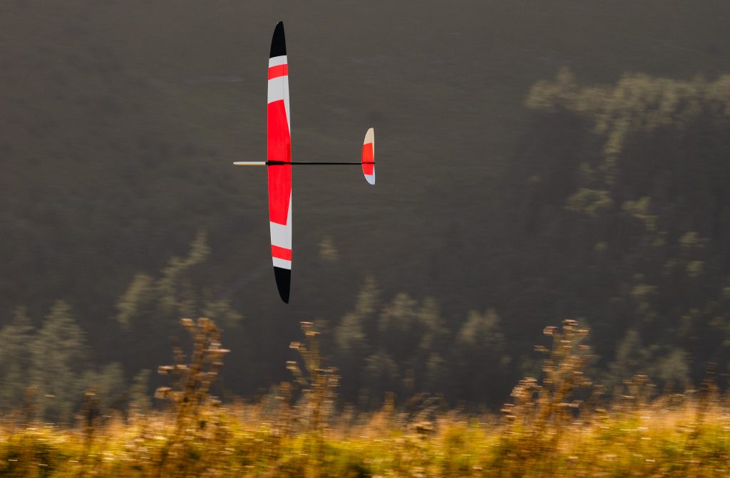 Model flying along the slope