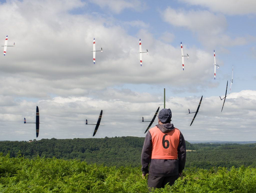 Composite image of model rounding a base