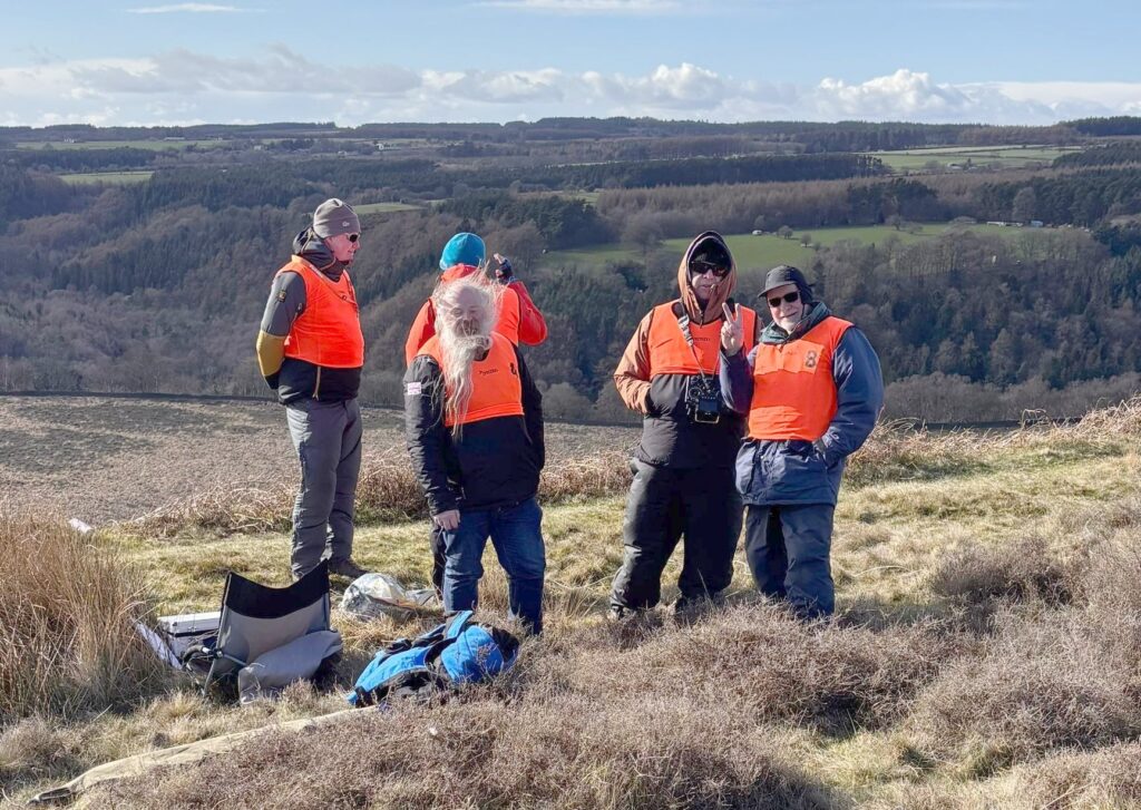 A Motley crew stay warm on the edge before the start.